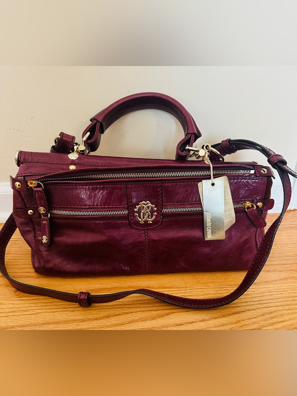 Brand new Roberto Cavalli burgundy leather purse